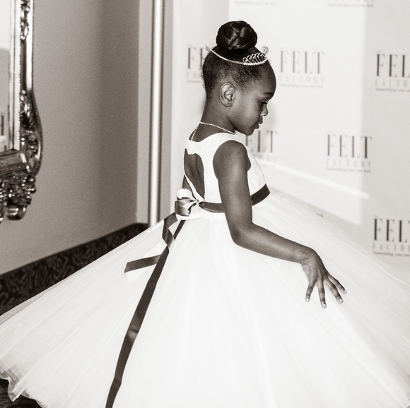 Three flower girl dresses with tierra